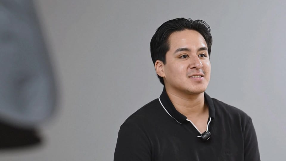 Jose Gonzalez speaking in a black polo, a frame from the film Champions